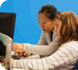 middle-class-two-girls-sitting-infront-laptop